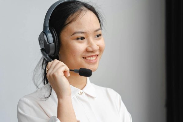 Support representative wearing a headset managing calls to enhance customer service response time