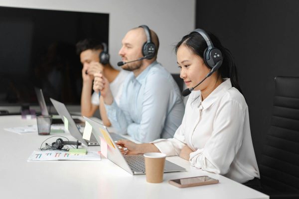 Call center agents handling customer calls as part of a personalized customer experience strategy