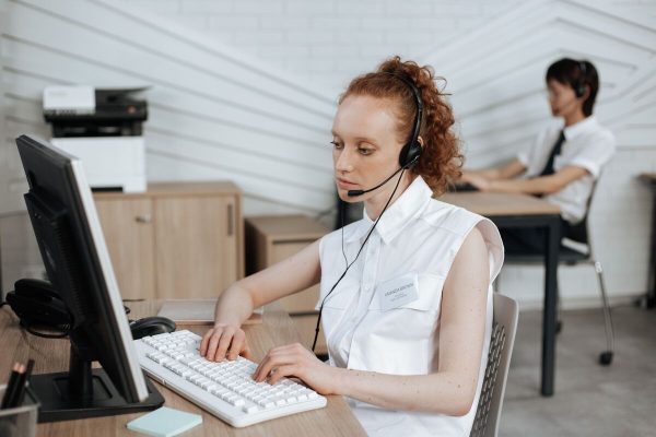 Customer service outsourcing agent assisting customers by phone